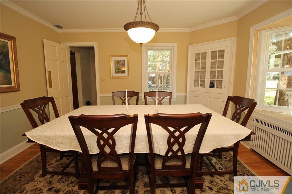 40 Stafford Road Colonia, NJ 07067 - Photo 15 of 25 a view of a dining room with furniture and wooden floor