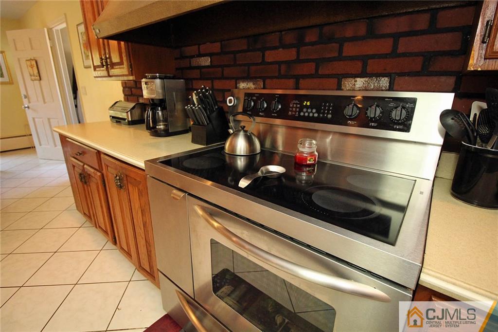 40 Stafford Road Colonia, NJ 07067 - Photo 16 of 25 a kitchen with a sink and cabinets