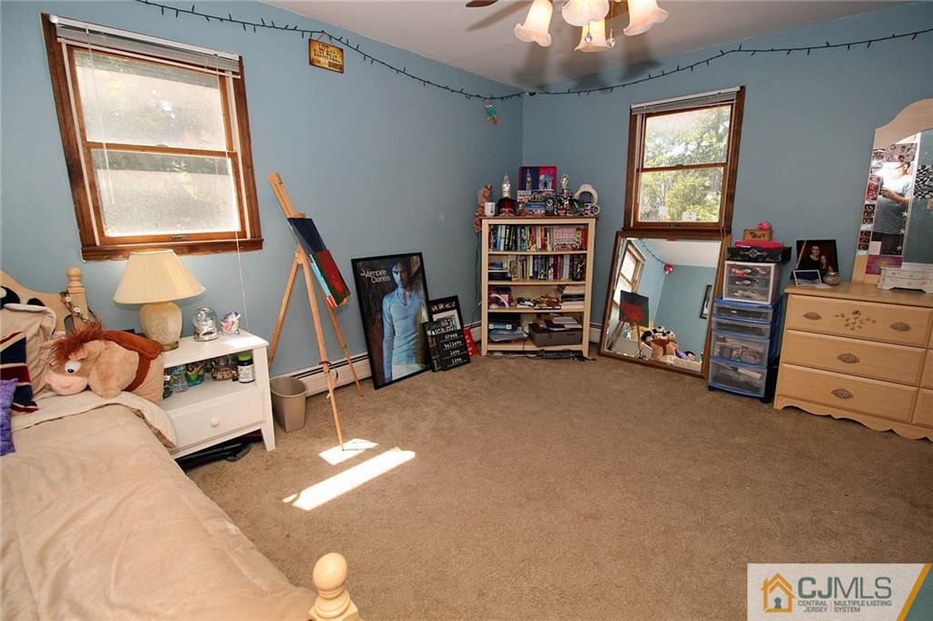 40 Stafford Road Colonia, NJ 07067 - Photo 22 of 25 a view of a bedroom with furniture and windows