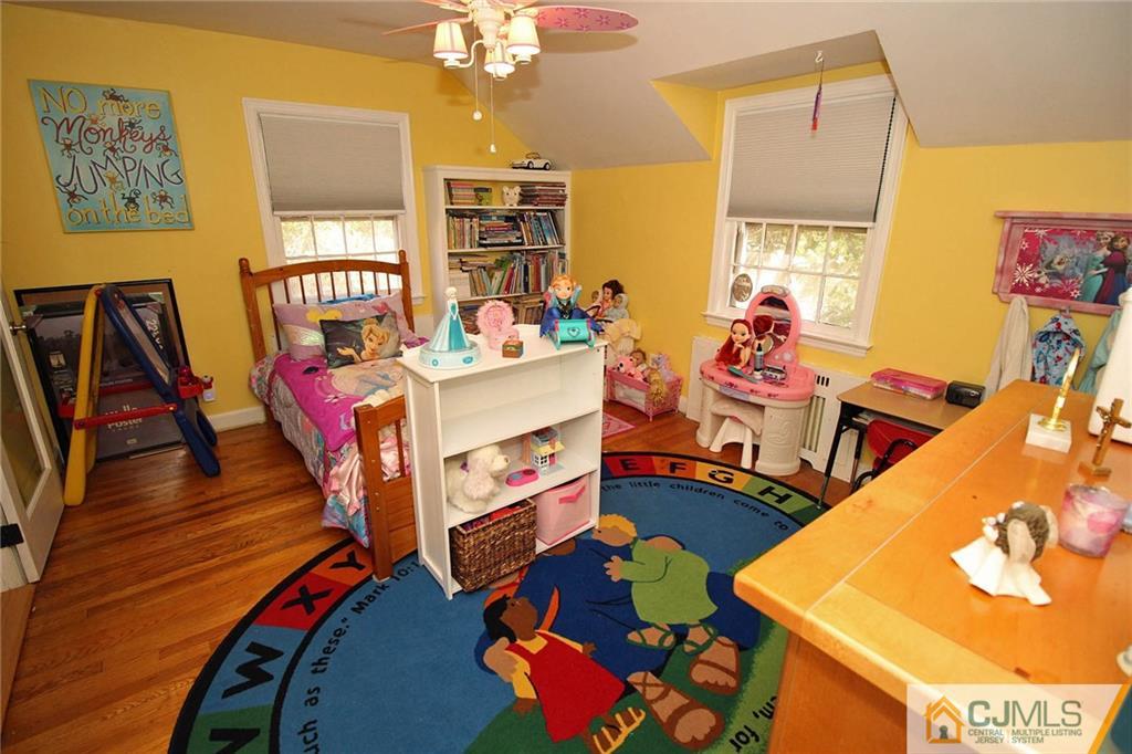 40 Stafford Road Colonia, NJ 07067 - Photo 23 of 25 a bedroom with furniture and a wooden floor