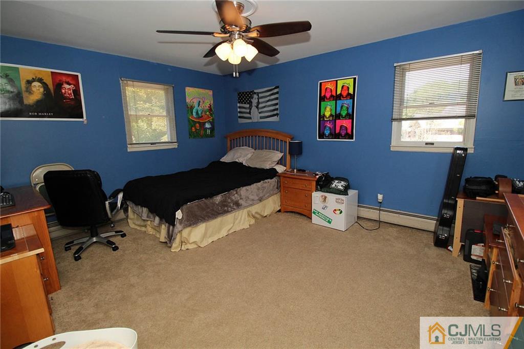 40 Stafford Road Colonia, NJ 07067 - Photo 24 of 25 a bedroom with furniture and a ceiling fan