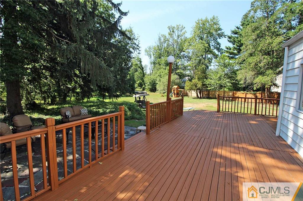 40 Stafford Road Colonia, NJ 07067 - Photo 4 of 25 a view of a deck with wooden floor and fence