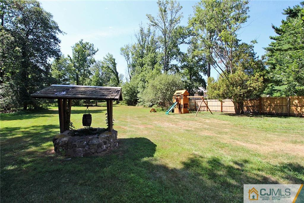 40 Stafford Road Colonia, NJ 07067 - Photo 7 of 25 a view of a garden with a bench
