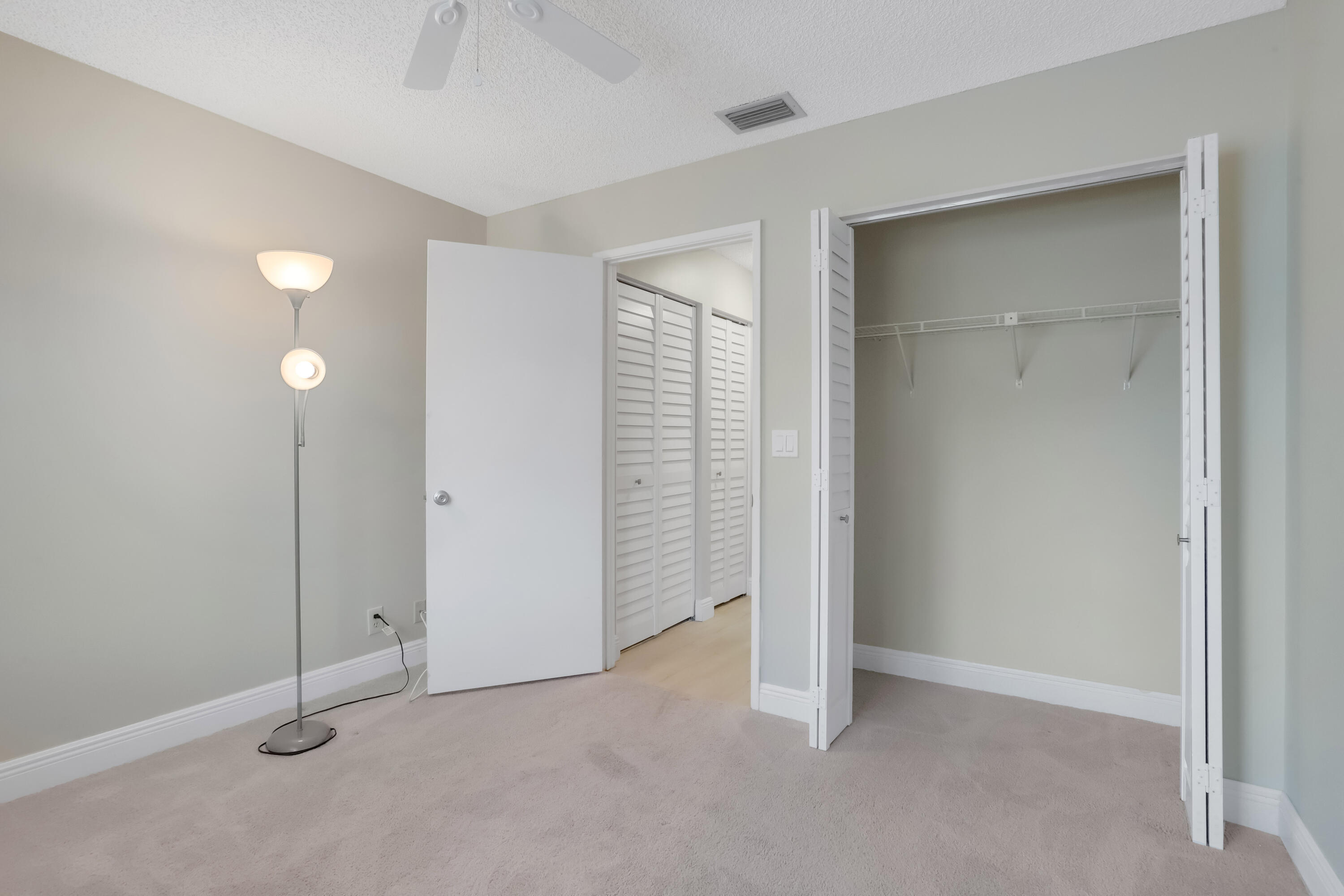 8910 Meadowlark Way, Unit 114 Boca Raton, FL 33496 - Photo 13 of 21 Guest Bedroom