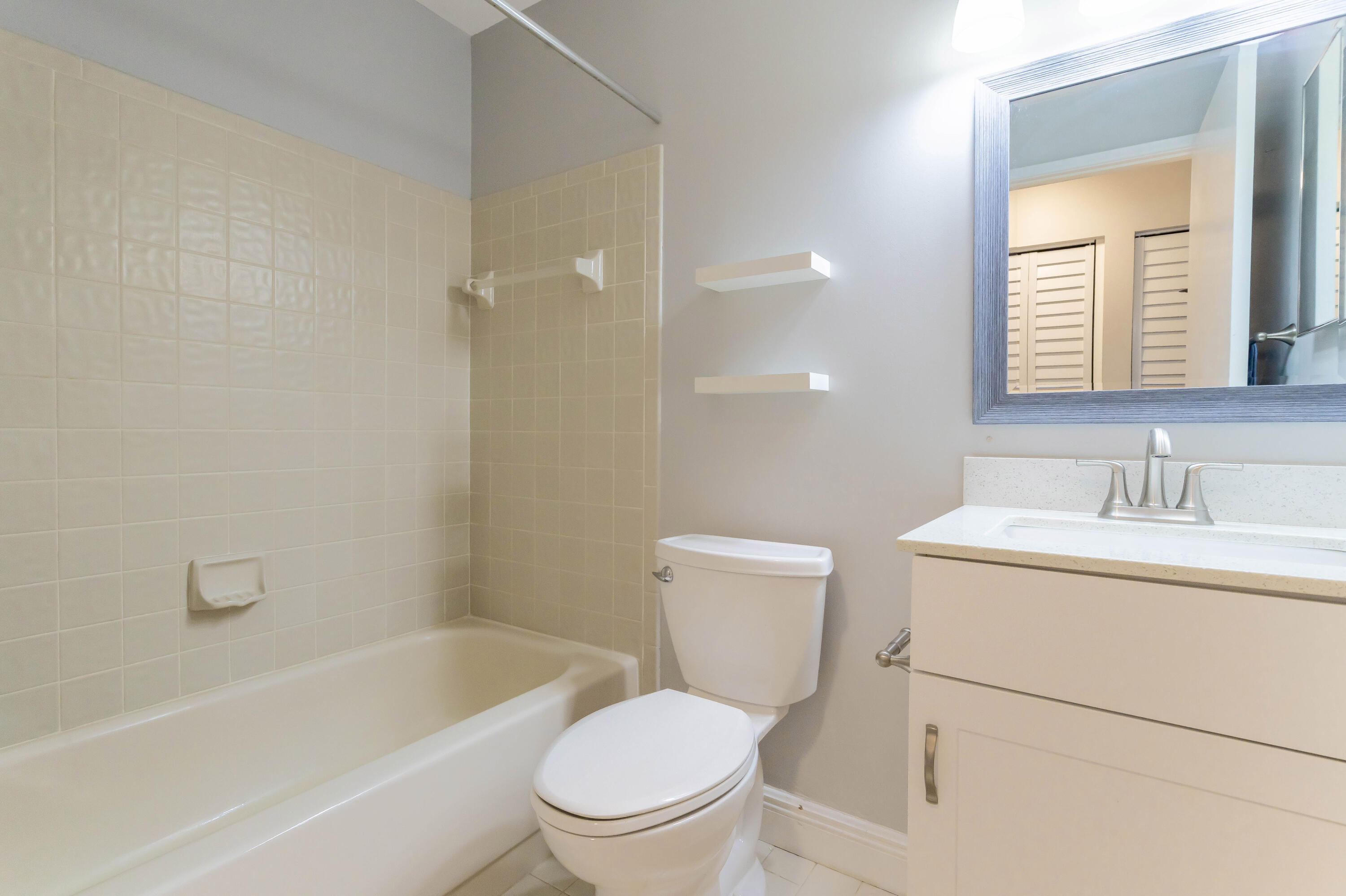 8910 Meadowlark Way, Unit 114 Boca Raton, FL 33496 - Photo 14 of 21 Guest Bathroom
