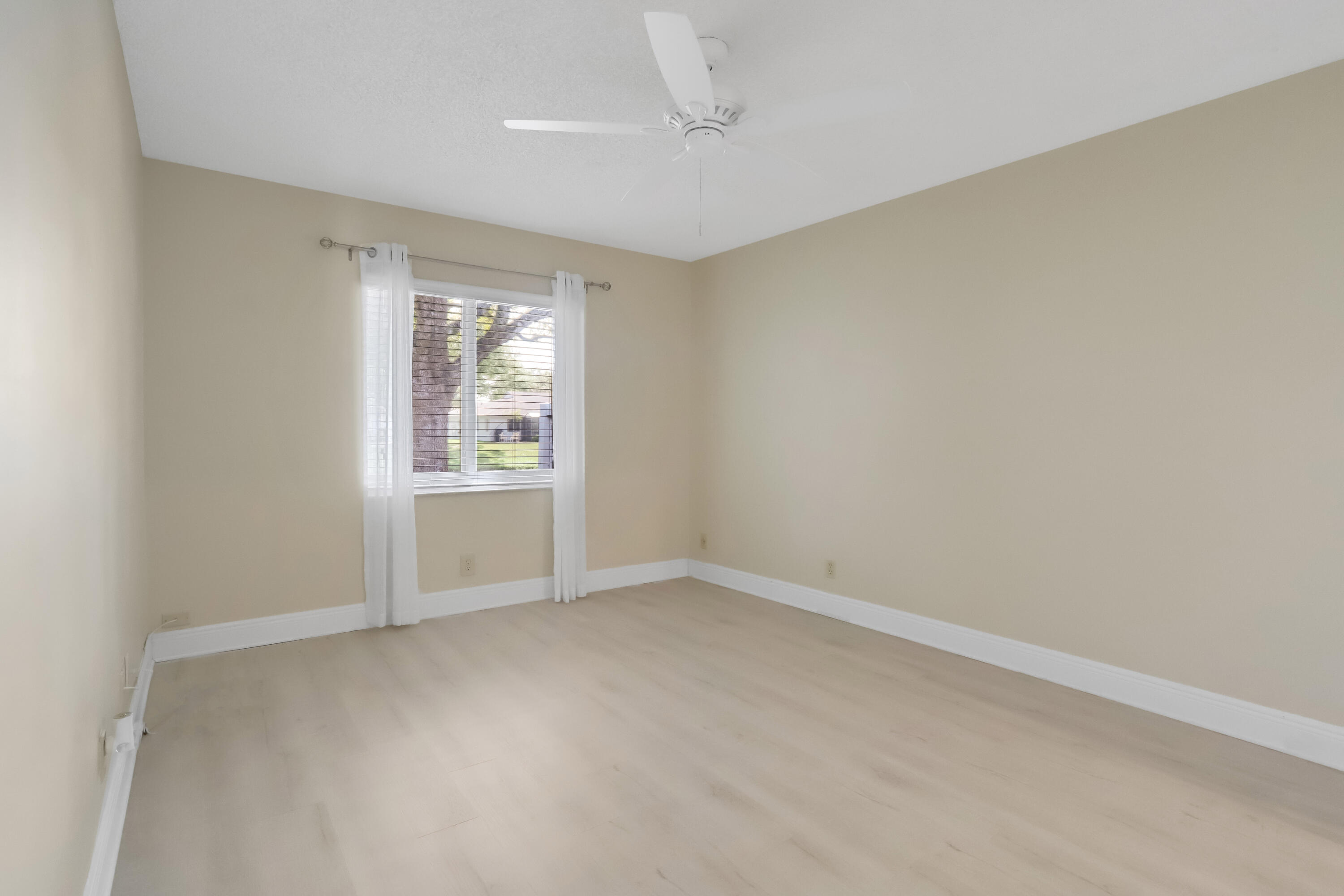 8910 Meadowlark Way, Unit 114 Boca Raton, FL 33496 - Photo 9 of 21 Primary Bedroom