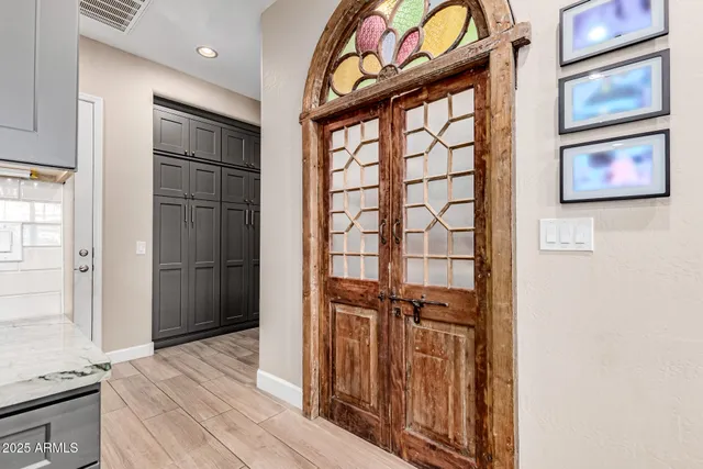 a view of an entryway with wooden floor