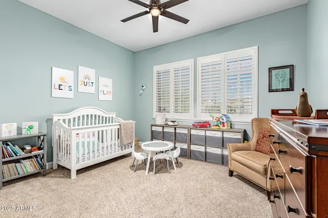 a bathroom with a granite countertop toilet sink and mirror