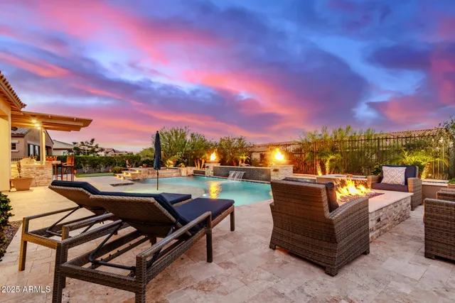 a view of a roof deck with couches and city view