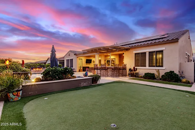 a view of a yard with a table and chairs