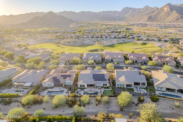 an aerial view of residential houses and outdoor space