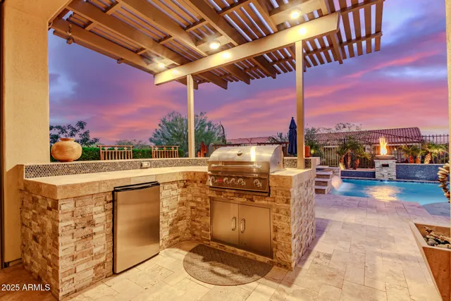 a view of a patio with a table and chairs