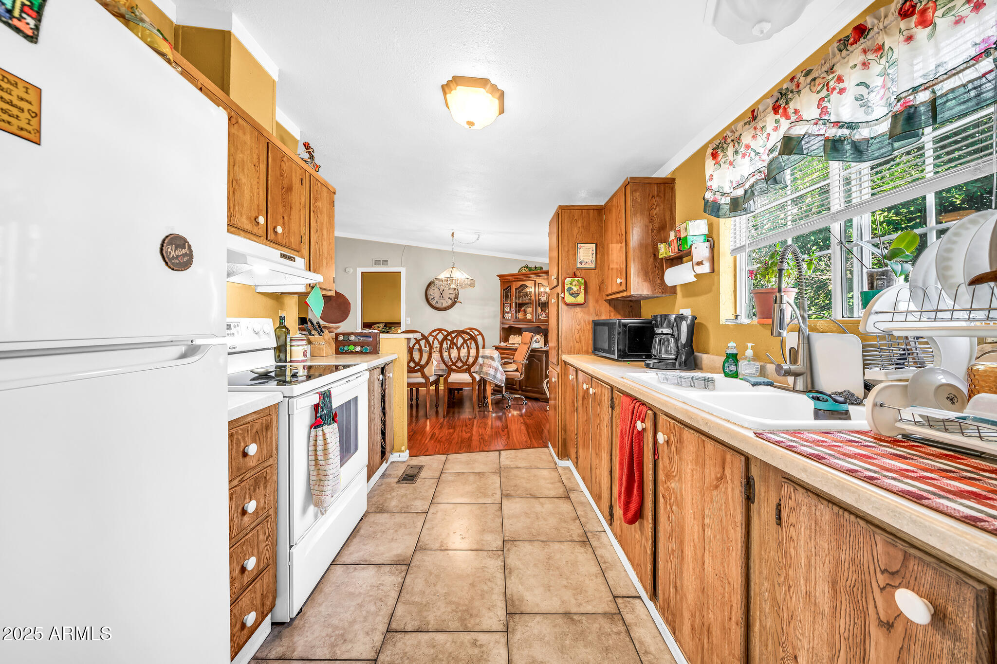 2510 East Utopia Road Phoenix, AZ 85050 - Photo 15 of 31 a large kitchen with stainless steel appliances granite countertop a large counter top and a stove