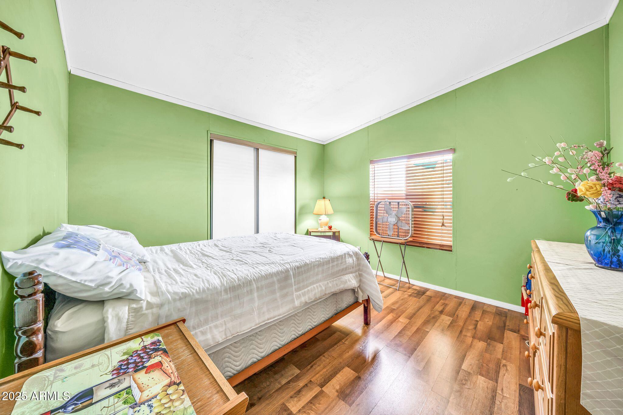 2510 East Utopia Road Phoenix, AZ 85050 - Photo 21 of 31 a bedroom with a bed and a window