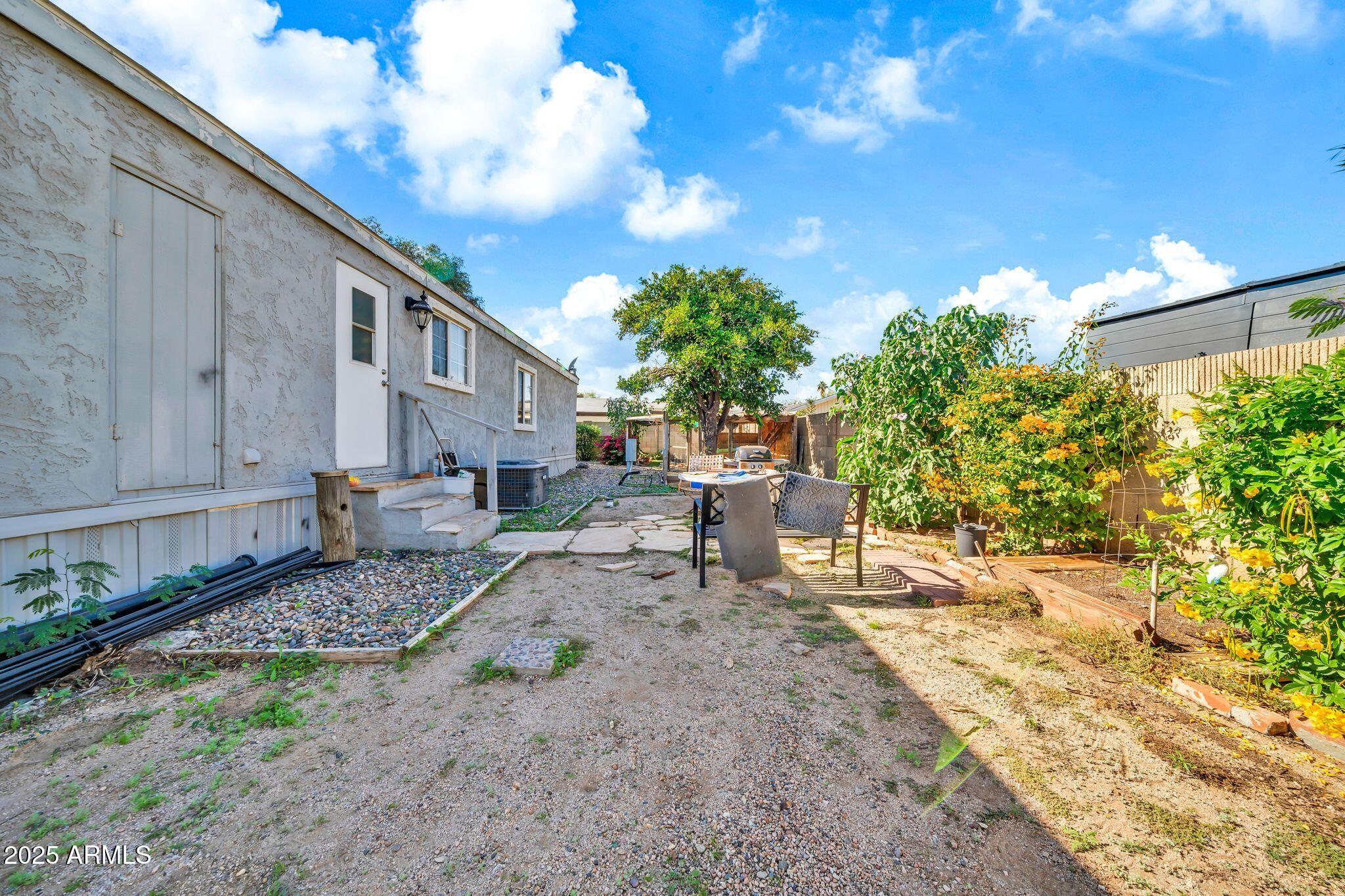 2510 East Utopia Road Phoenix, AZ 85050 - Photo 30 of 31 a view of a backyard with sitting area