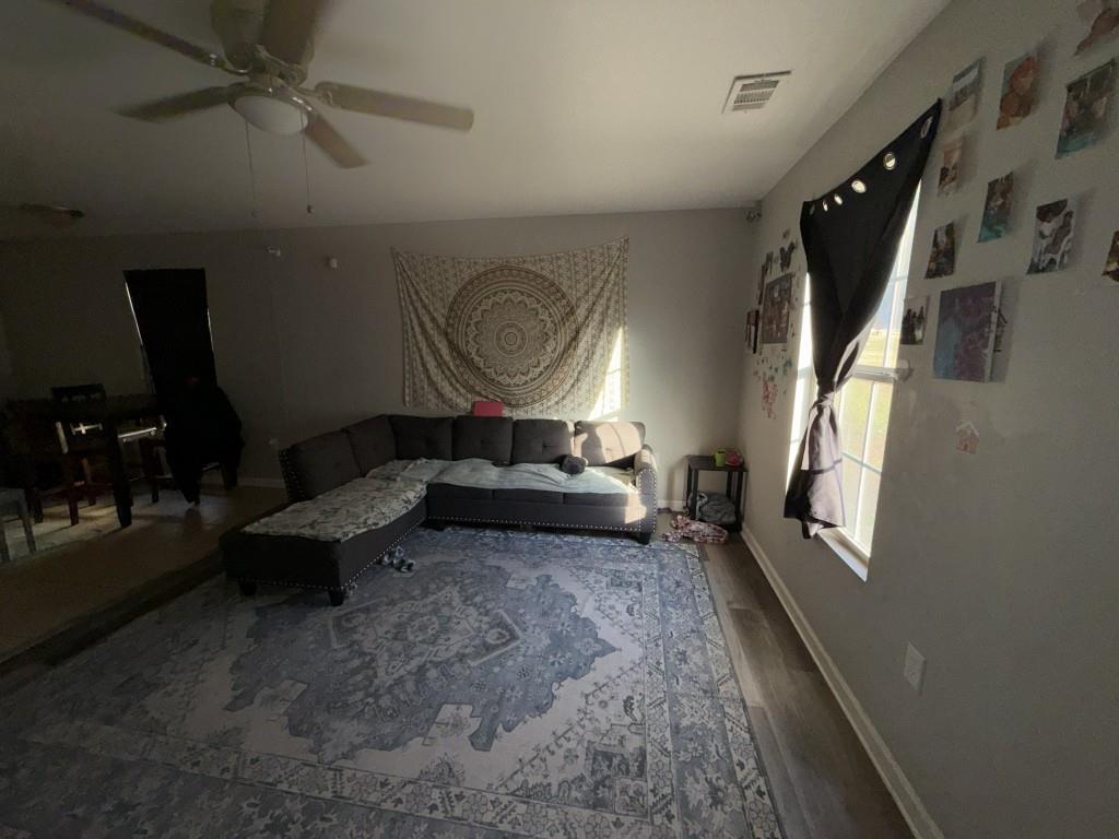 3454 Lawton Road Macon, GA 31204 - Photo 2 of 13 a living room with furniture and a window