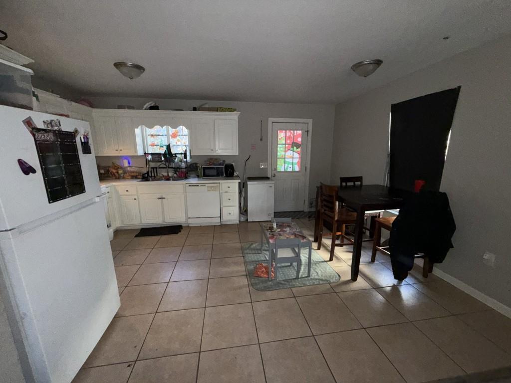 3454 Lawton Road Macon, GA 31204 - Photo 4 of 13 a kitchen with furniture a counter top space and stainless steel appliances