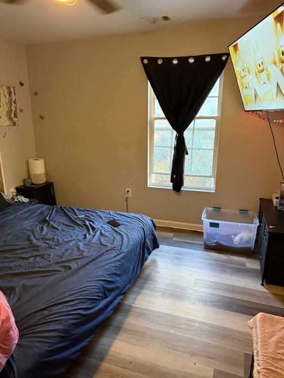 3454 Lawton Road Macon, GA 31204 - Photo 8 of 13 a bedroom with a bed and window