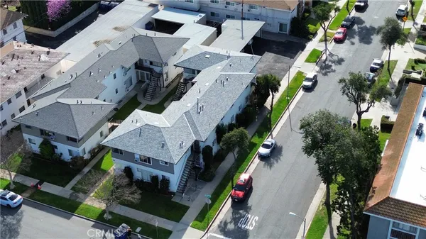 an aerial view of a house with a yard and potted plants