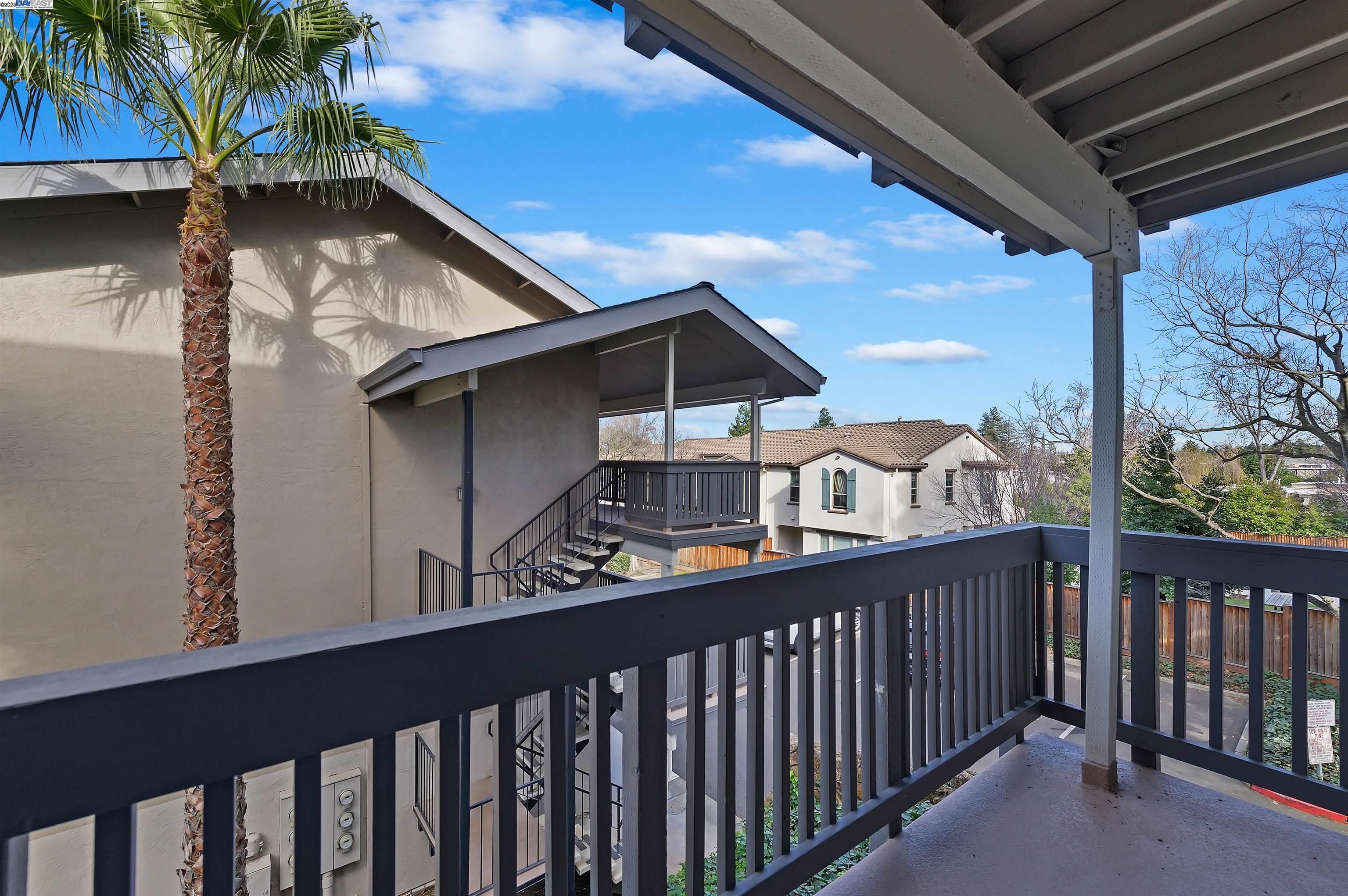3849 Vineyard Avenue, Unit B Pleasanton, CA 94566 - Photo 20 of 21 a yellow and red house sitting in front of a house