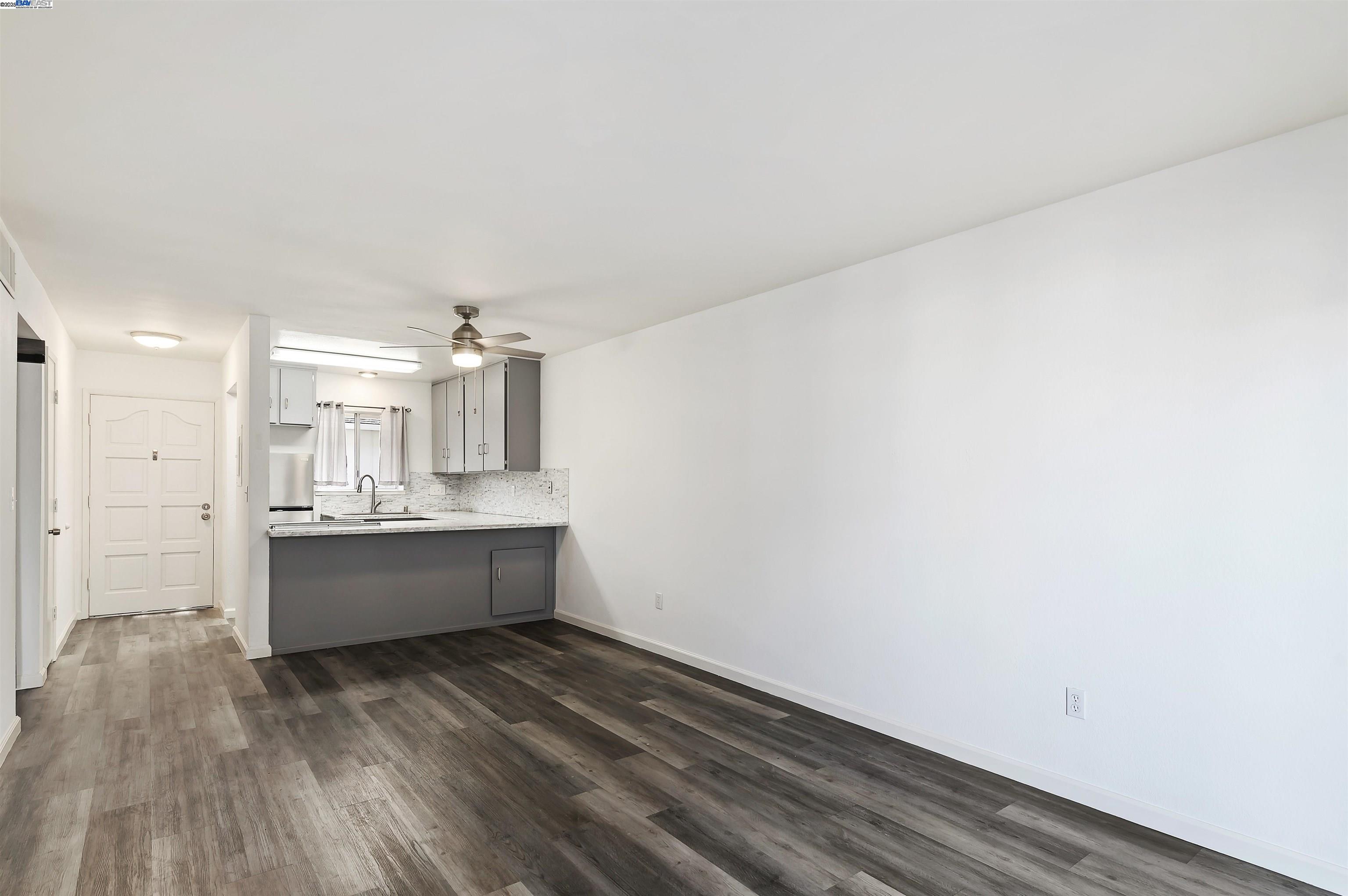 3849 Vineyard Avenue, Unit B Pleasanton, CA 94566 - Photo 7 of 21 a large room with wooden floor