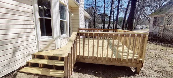 a view of outdoor space with deck and furniture