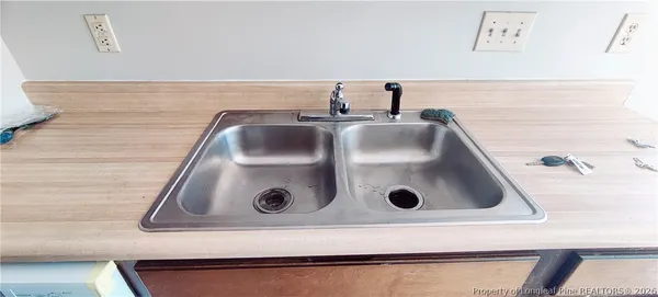 a close view of sink and a stove