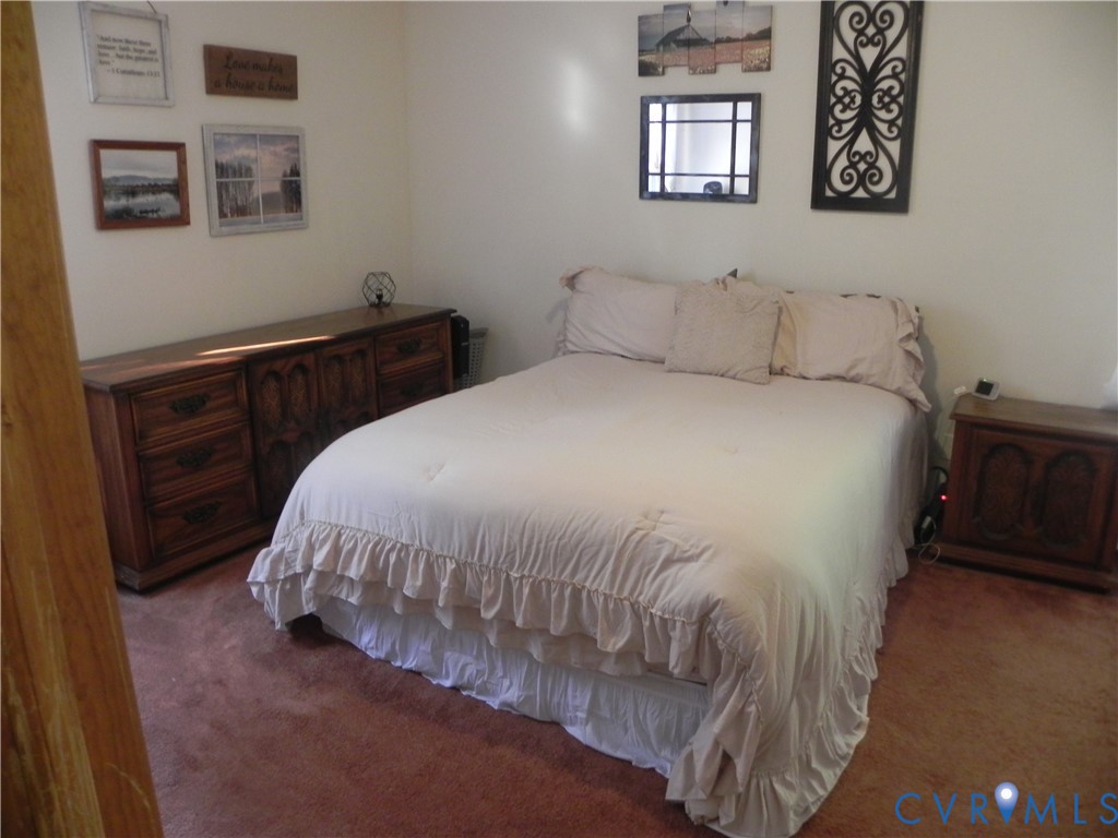 830 Grapevine Road Sandston, VA 23150 - Photo 6 of 16 Bedroom featuring plush, neutral-toned carpeting a