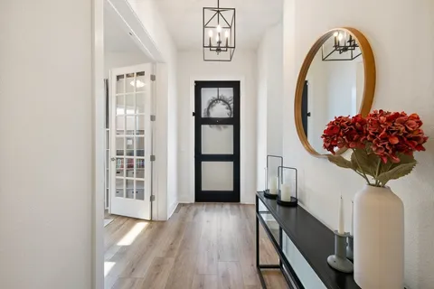 a view of a hardwood & utility room