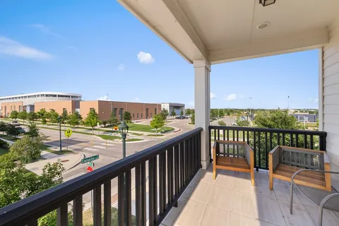 a view of a backyard with wooden fence