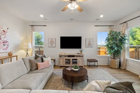 a living room with furniture and a flat screen tv
