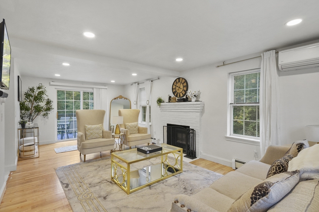 108 Royalston Road North Winchendon, MA 01475 - Photo 11 of 32 a living room with furniture a fireplace and a potted plant