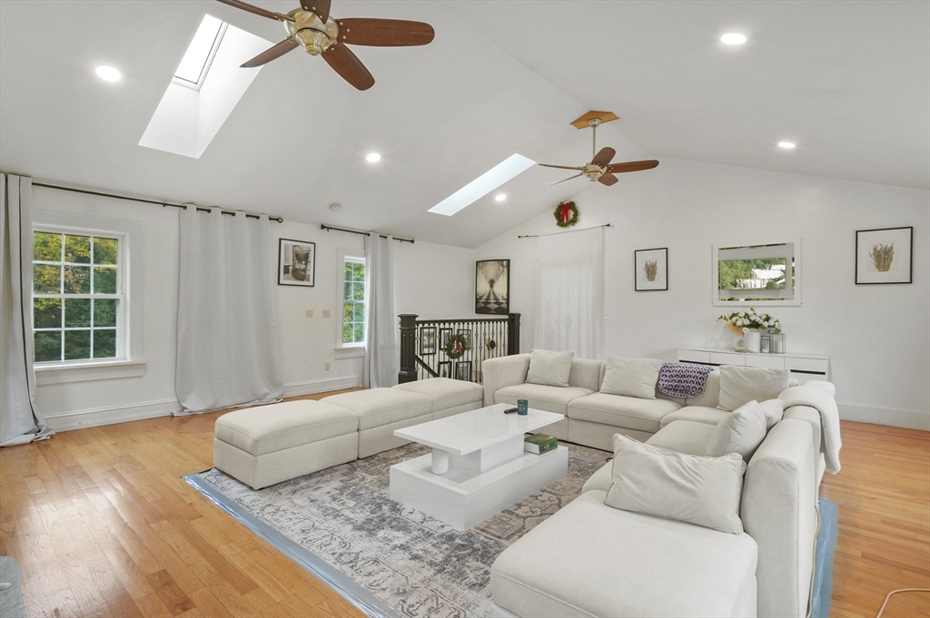108 Royalston Road North Winchendon, MA 01475 - Photo 16 of 32 a spacious bedroom with a bed couch and a window