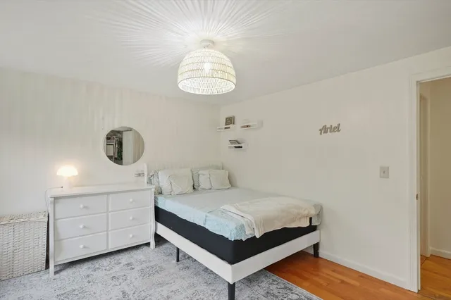 a bedroom with a bed and cabinets