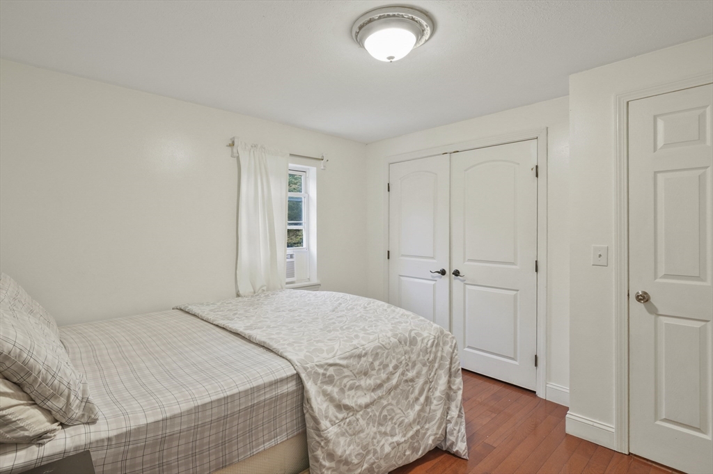 108 Royalston Road North Winchendon, MA 01475 - Photo 24 of 32 a bedroom with a bed and wooden floor