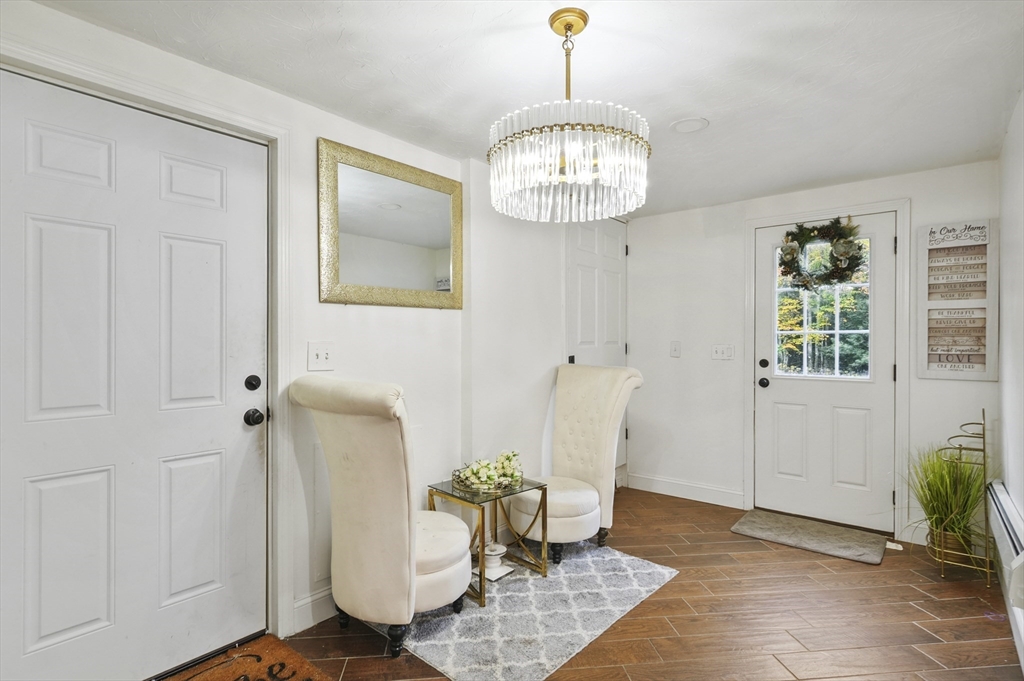 108 Royalston Road North Winchendon, MA 01475 - Photo 5 of 32 a view of a livingroom with furniture and chandelier