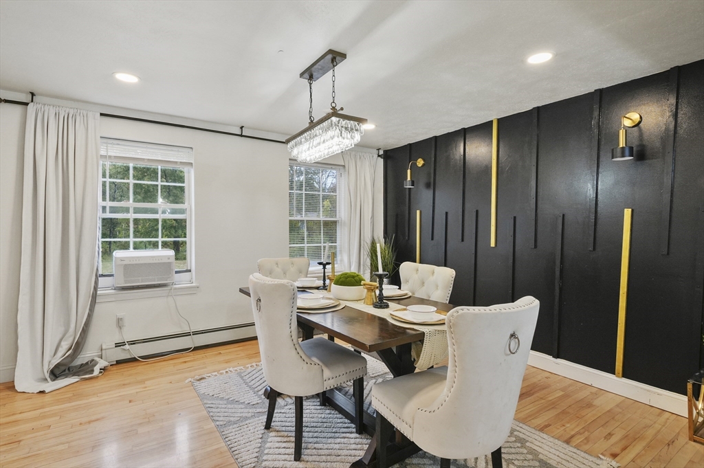 108 Royalston Road North Winchendon, MA 01475 - Photo 9 of 32 a dining room with furniture a chandelier and wooden floor