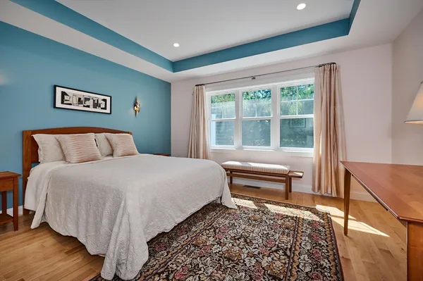 a bedroom with a bed and a couch