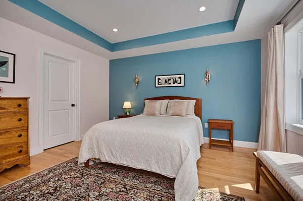a bedroom with a bed and a dresser
