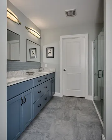 a spacious bathroom with a granite countertop sink and a mirror
