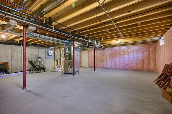 a view of empty room with wooden walls
