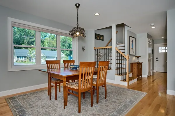 a view of a dining room with furniture window and wooden floor