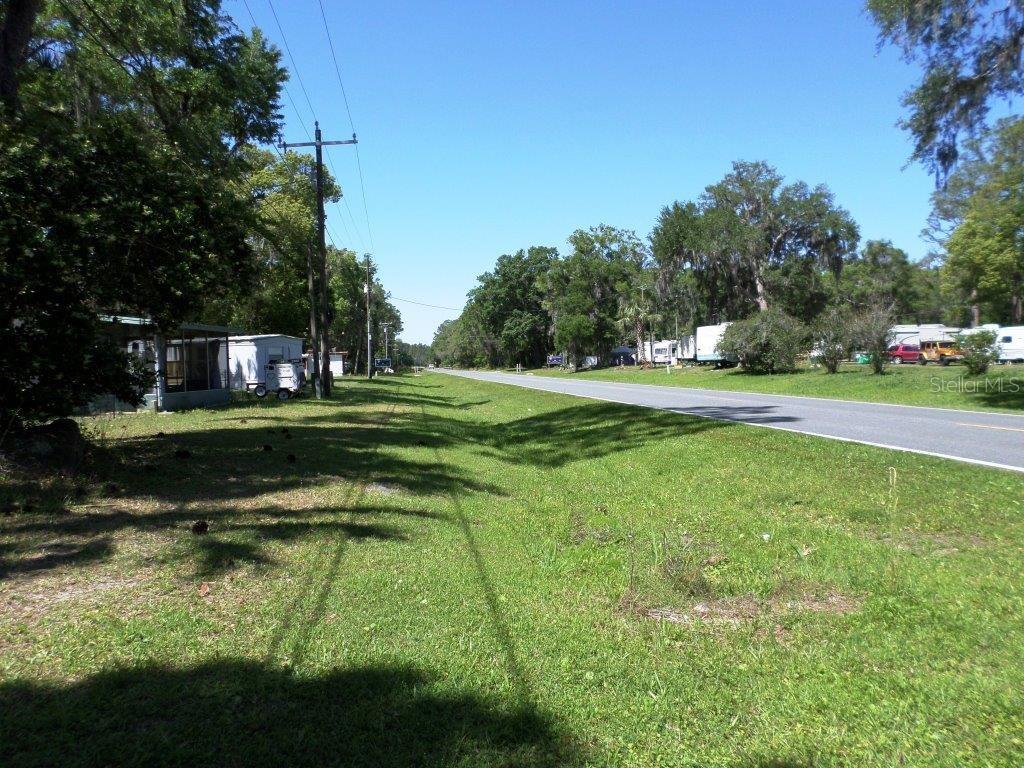 10150 State Highway 40 Inglis, FL 34449 - Photo 16 of 18 a view of a swimming pool with a yard