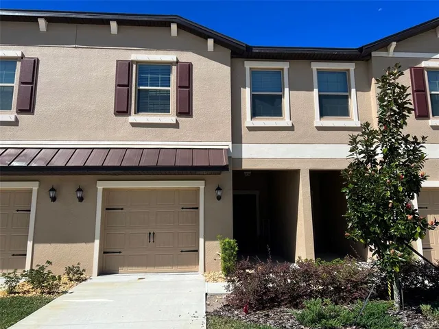 a front view of a house with a garage