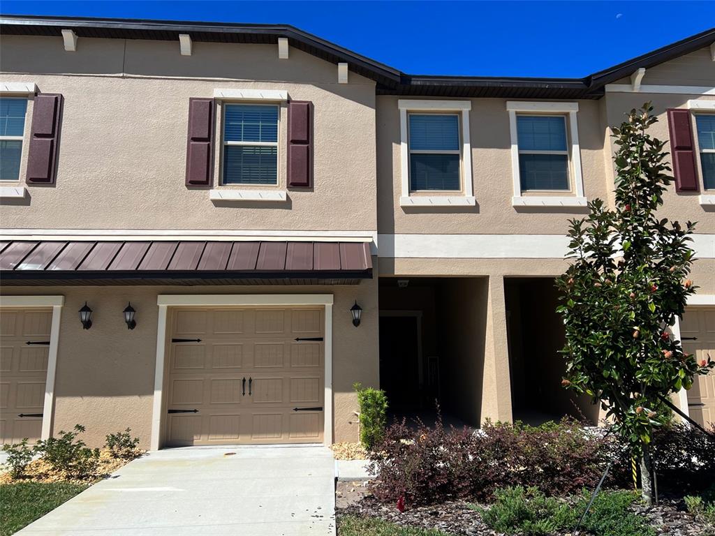 a front view of a house with a garage