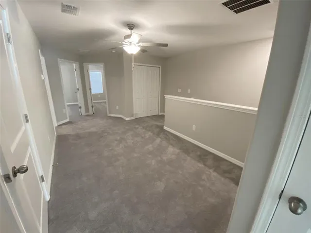 a bathroom with a toilet a sink and a mirror