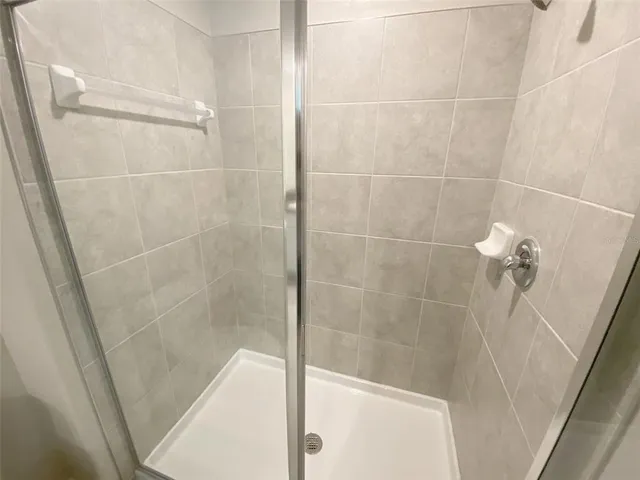 a bathroom with a double vanity sink and mirror