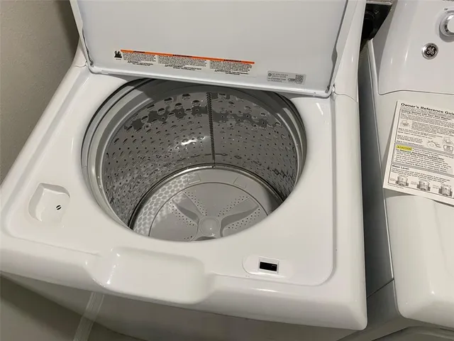 a front view of a house with a garden and patio