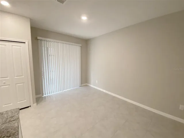 a room with gym equipment and a large window