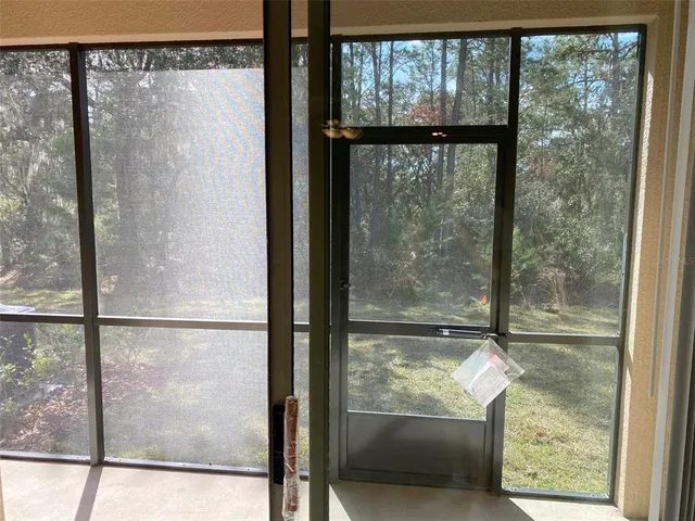a view of a house with swimming pool and porch